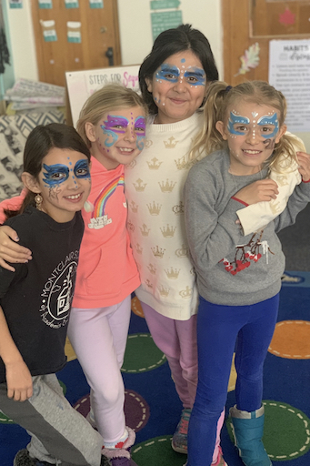 Students posing with face paint