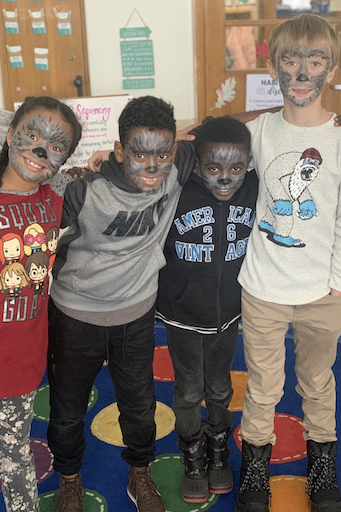 Students posing with face paint