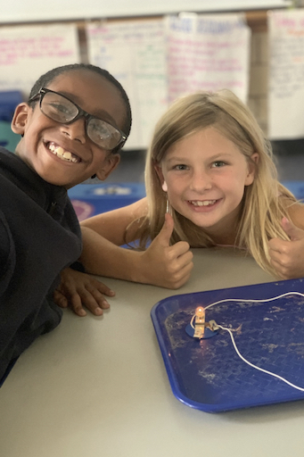 Two students posing in class